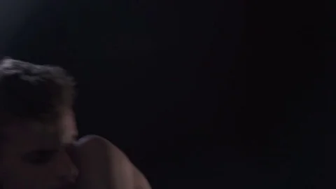 Man dances in the dark Stock Footage 77377502