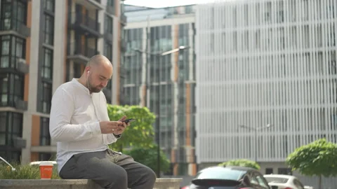 Man dances to music while drinking coffee during a break Stock Footage 208676426