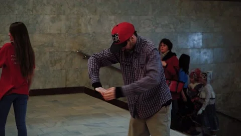 A man dances a robot dance, a pantomime in an underground passage Stock Footage 130751268