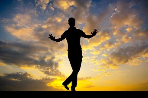 Man dances the tap dance at sunset Stock Illustration