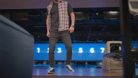 A man dances a victory dance in a bowling club. Celebrating by doing a Stock Footage 168226908