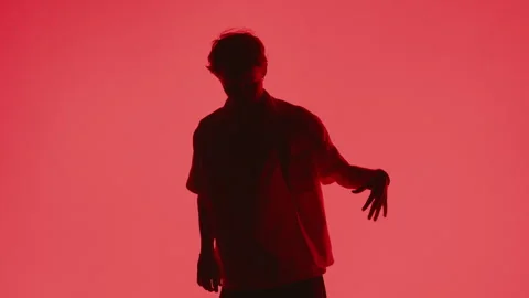 Man Dancing Against Red Backdrop Video stock 255537729