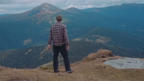 Man dancing and having fun in mountains Stock Footage 82852319