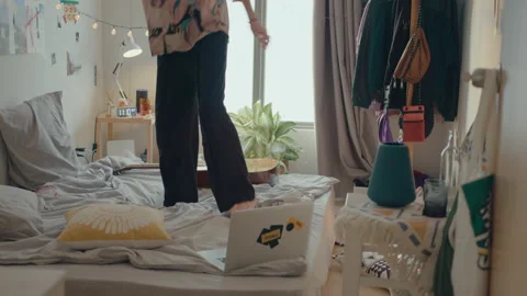 Man Dancing and Having Fun on Bed Stock Footage 235656705