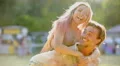 Man dancing and singing, cheerful girl jumping on his back, having fun together 4k or 4k+ Resolution