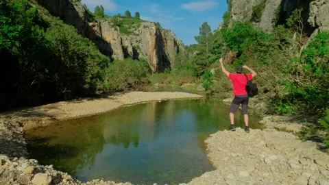 Man is dancing with a backpack. Male is hiking in nature. Stock Footage 196860256