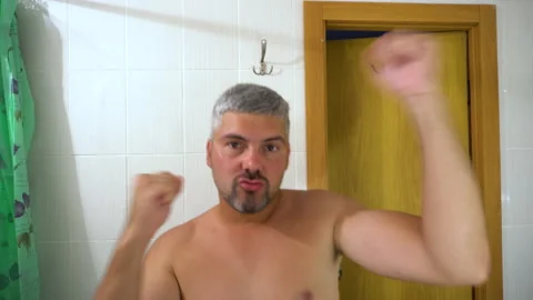 Man dancing in the bathroom 4K Stock Footage 156772155