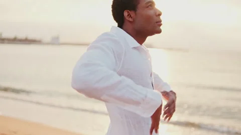 Man Dancing on Beach at Sunset Stock Footage 305956786