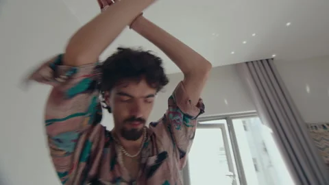 Man Dancing with Cigarette on Bed Stock Footage 235660912