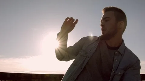 Man dancing in the city at dawn Stock Footage 79664727