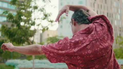 Man Dancing in City Park Stock Footage 324762856
