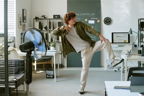 Man Dancing during Work Break in Modern Creative Office 스톡 사진