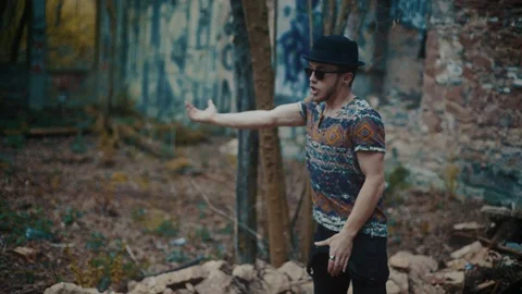 Man dancing in empty building with rubble Stock Footage 117917177