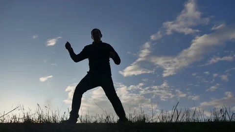 The man is dancing funny at sunset. funny video man silhouette dancing lifestyle Stock Footage 90962868