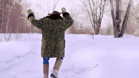 Man dancing funny in winter on the street Stock Footage 109250161