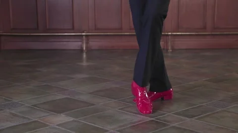 A man is dancing, a lady invites him to dance together, flirtingб legs Stock Footage 68965658