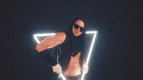 Man dancing in light triangle Stock Footage 105445259