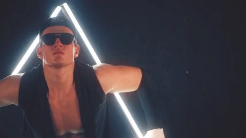 Man dancing in light triangle Stock Footage 105448533