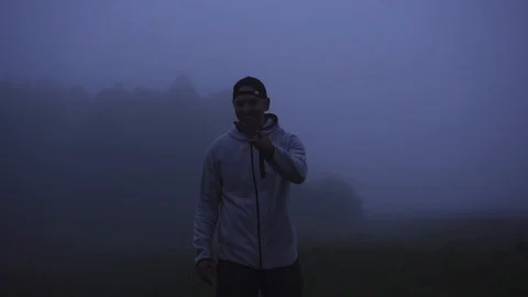 Man dancing in the mist Stock Footage 95999375