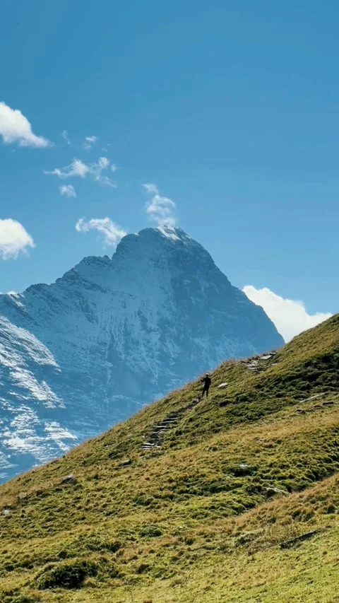 Man Dancing on Mountain Trail in the Swiss Alps Stock Footage 329250527