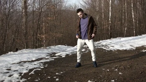 Man dancing in the mountains in spring season Video stock 82632824