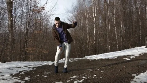 Man dancing in the mountains in spring season 스톡 동영상 82633362