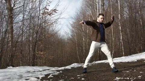 Man dancing in the mountains in spring season 스톡 동영상 82648953