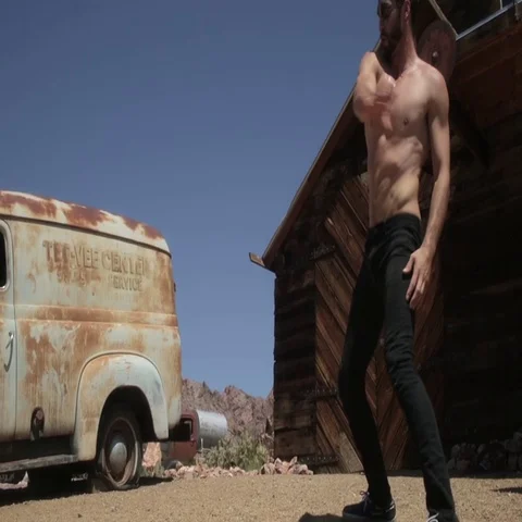Man dancing with a naked torso and black... | Stock Video | Pond5