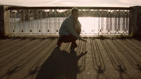 Man dancing near the river Vídeos de archivo 79658328