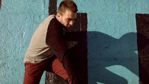 Man dancing in near the wall at dawn. Stock Footage 79692314