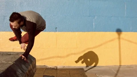 Man dancing in near the wall at dawn. Stock Footage 79725908