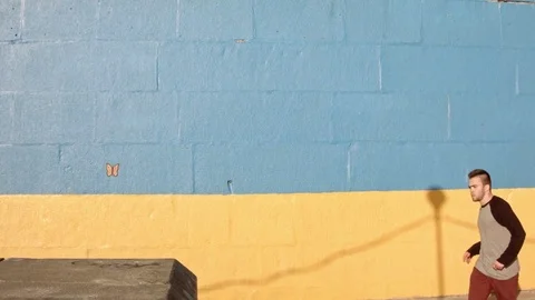 Man dancing in near the wall at dawn. 動画素材 79727311