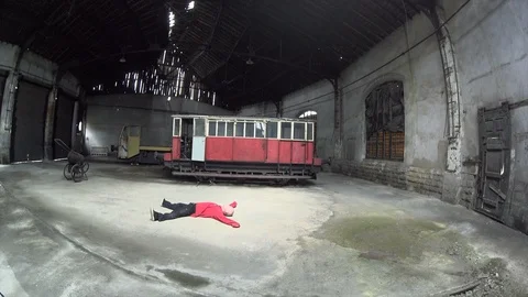 Man Dancing in an old train factory Stock Footage 104463241