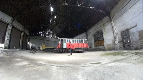 Man Dancing in an old train factory. hip hop strange dance  Video stock 104463321