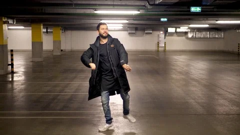The man dancing in the Parking. 4K UHD Stock Footage 83470701