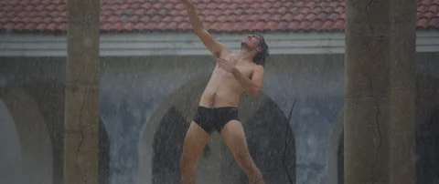 Man dancing in the rain Stock Footage 85811529