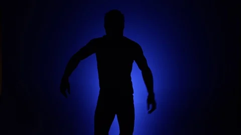 Man dancing silhouette blue background slomo 2 Stock Footage 90782321