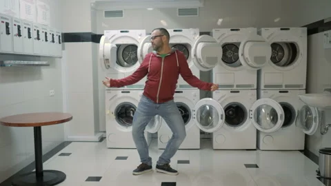 Man Dancing Swing And Have Fun In the Laundry  Room. Happy Man Enjoying Dance 스톡 동영상 121449764
