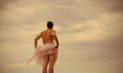 Man dancing in tutu in ballet studio, copy space. Funny man freak. Crazy Фото