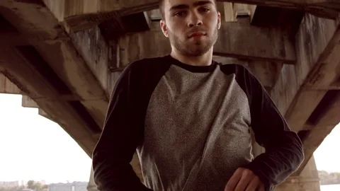 Man dancing under a bridge 스톡 동영상 79698739