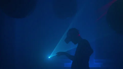 Man dancing in VR headset at virtual party. Cyberspace nightclub in metaverse Stock Footage 229695859
