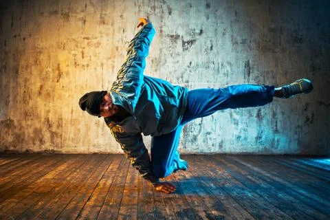 Man dancing on wall background 스톡 사진