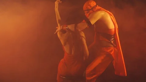 Man dancing for a woman in red Stock-Footage 101667112