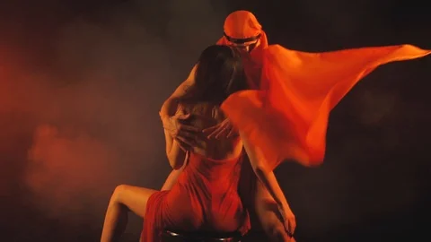 Man dancing for a woman in red Stock Footage 101667230