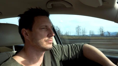 A man dangerously falling asleep while driving a car on a highway Stock Footage 104304144