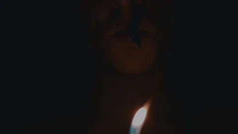 Man in the dark with cigarette close-up Stock Footage 71367505