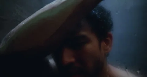 Man, dark shower and crying by glass in home, stress and mental health with ptsd Stock Footage 326093001