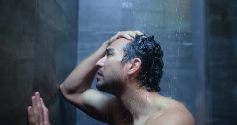 Man, dark shower and sad in bathroom at home, stress and mental health with ptsd Stock Footage 326465567