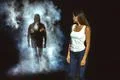 The man in the dark street following the woman Photo