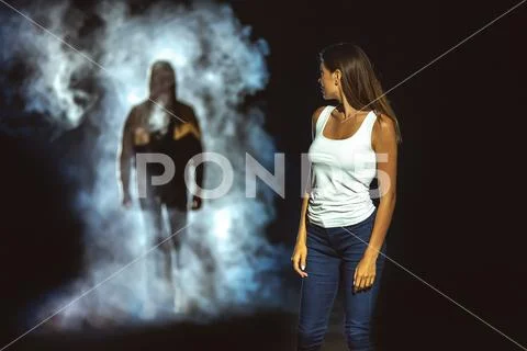 The man in the dark street following the woman Stock Photos